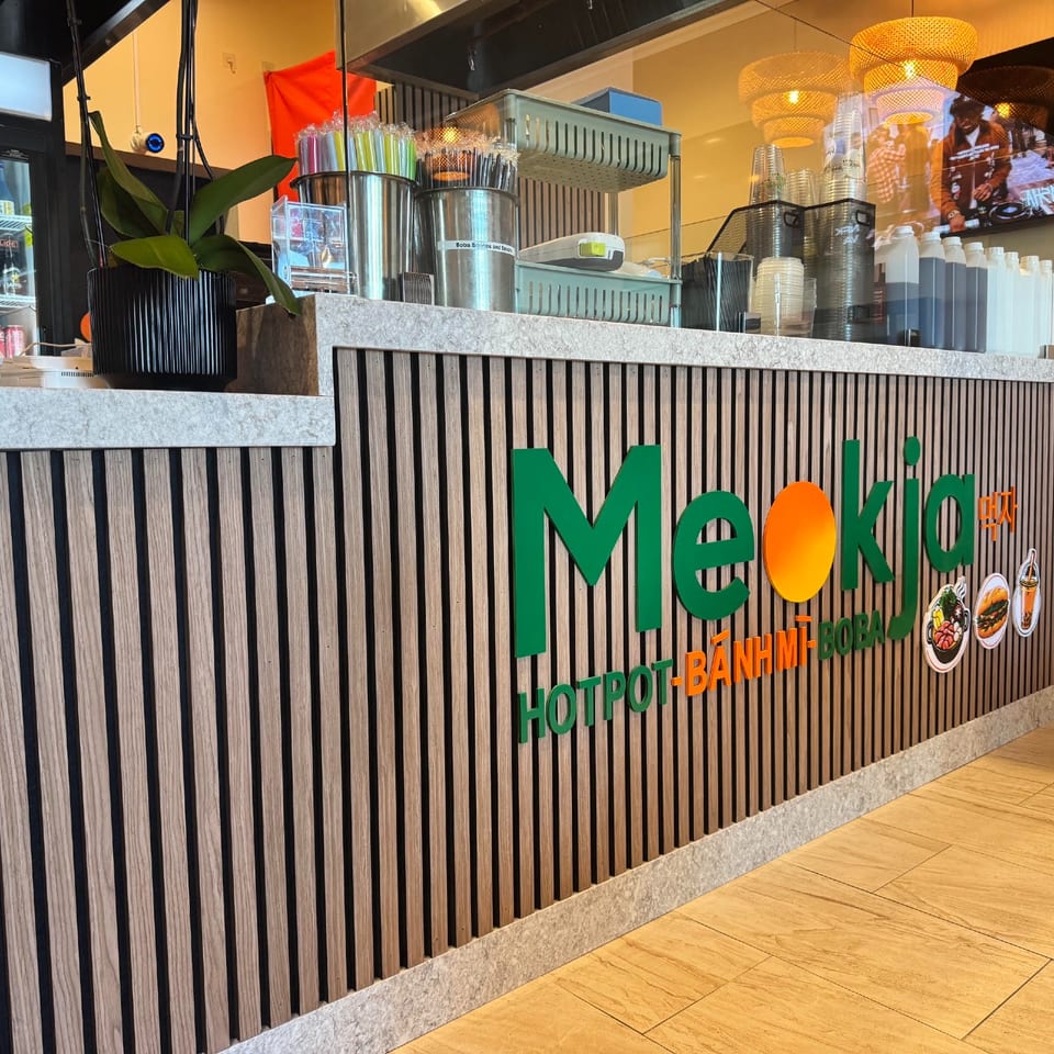 Meokja's wood-paneled front counter.